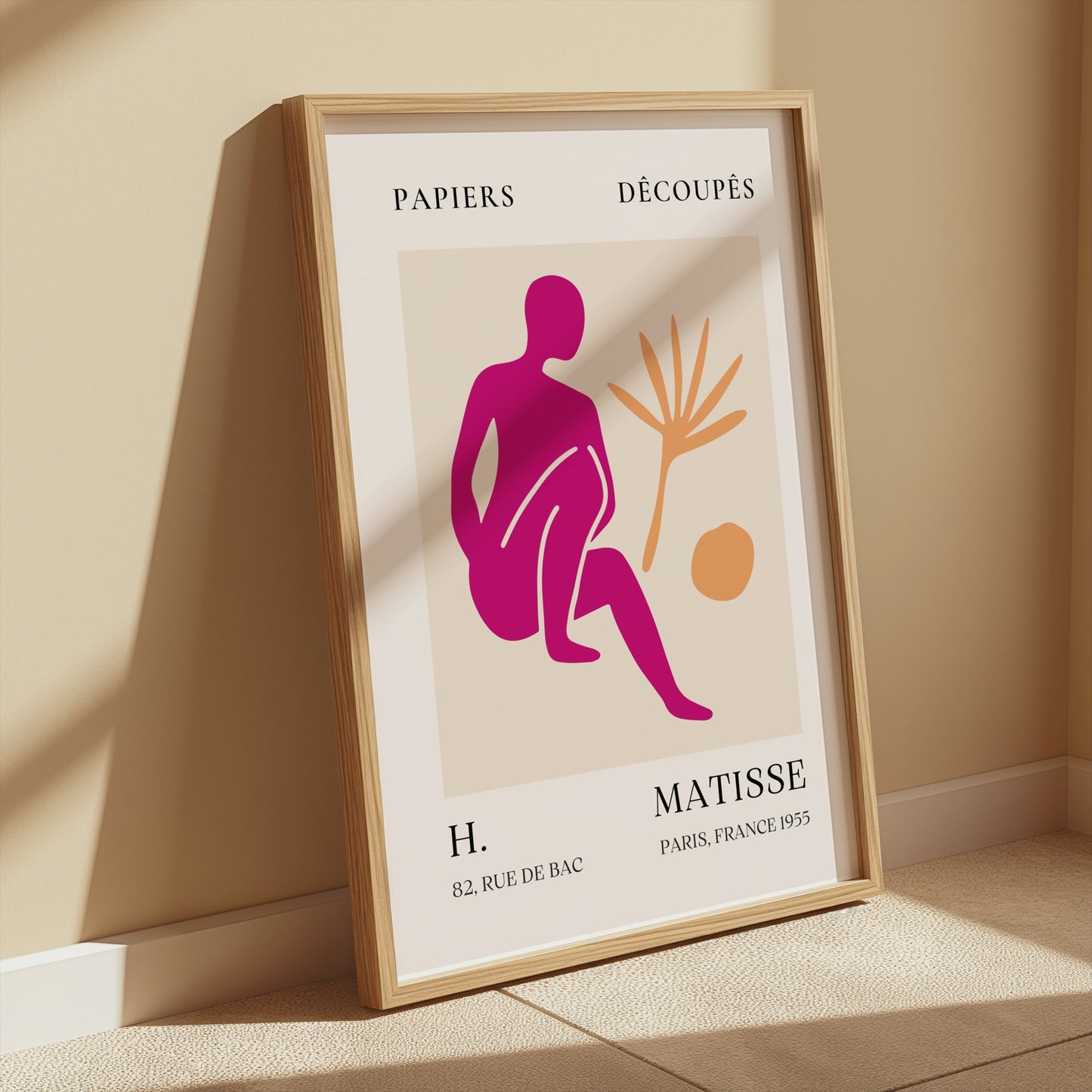 Henri Matisse inspired art print poster in a wooden frame, leaning against a beige wall with sunlight, ideal for stylish home decor.
