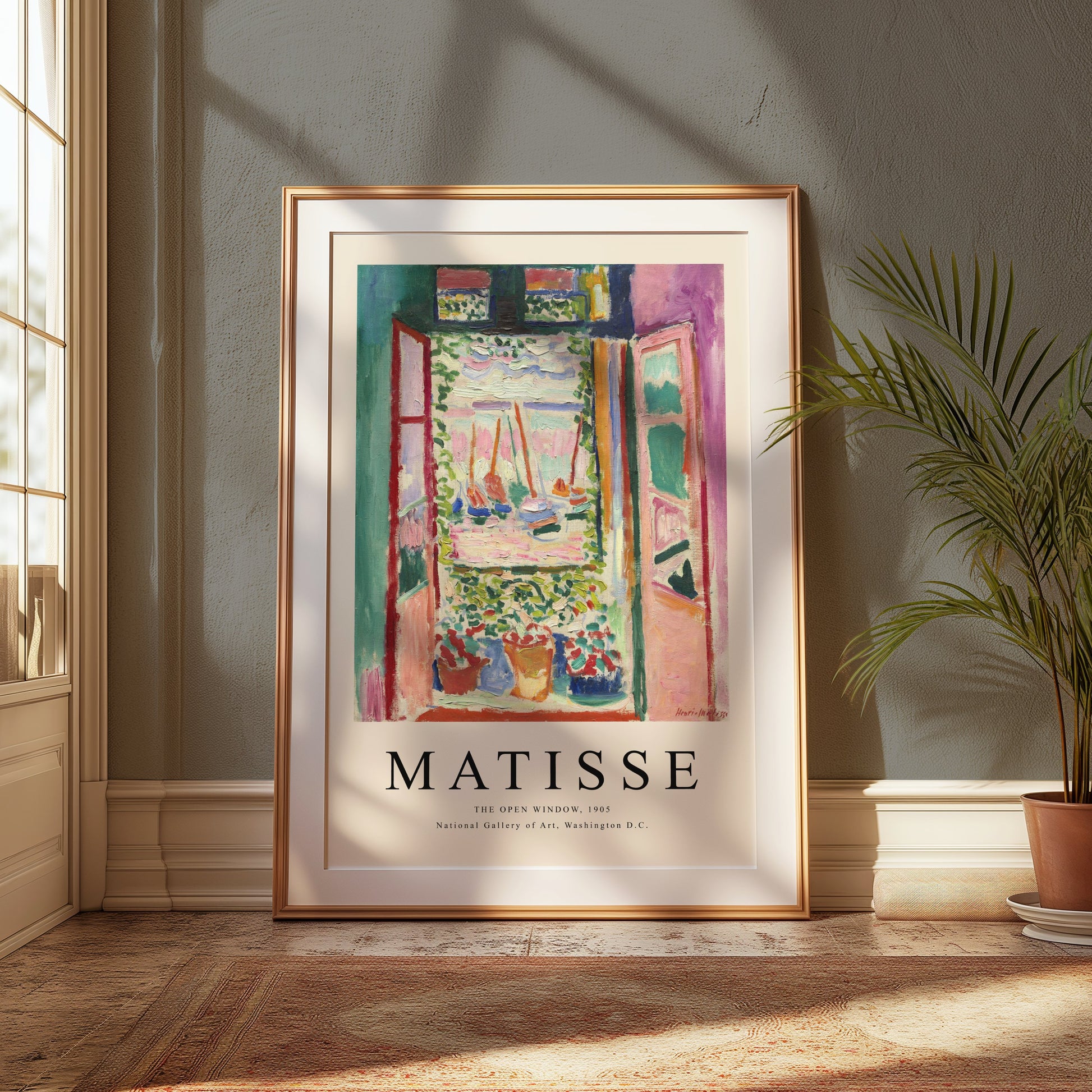 Framed The Open Window by Matisse 1905 art print poster leaning against a textured wall, illuminated by warm sunlight in a cozy setting.