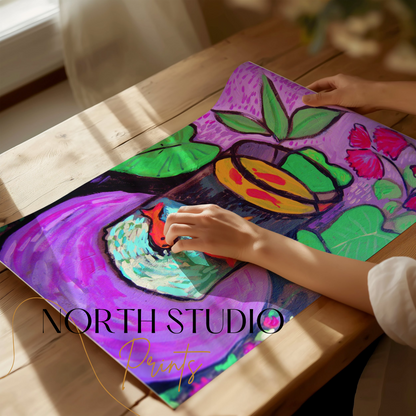 Unframed Matisse-inspired fish poster being rolled out on a wooden table, highlighting its bold colors and unique artwork.