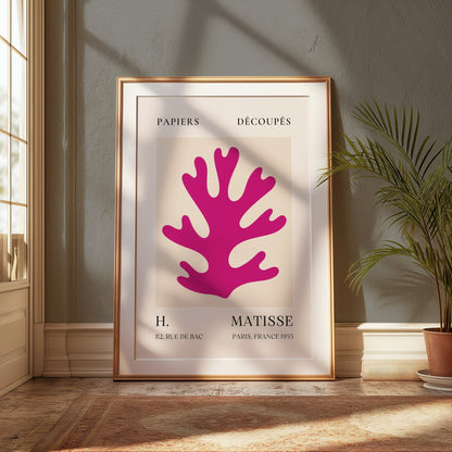 Framed Vintage Papiers Découpés poster by H Matisse, France 1955, displayed in a sunlit room with elegant decor and a potted plant.