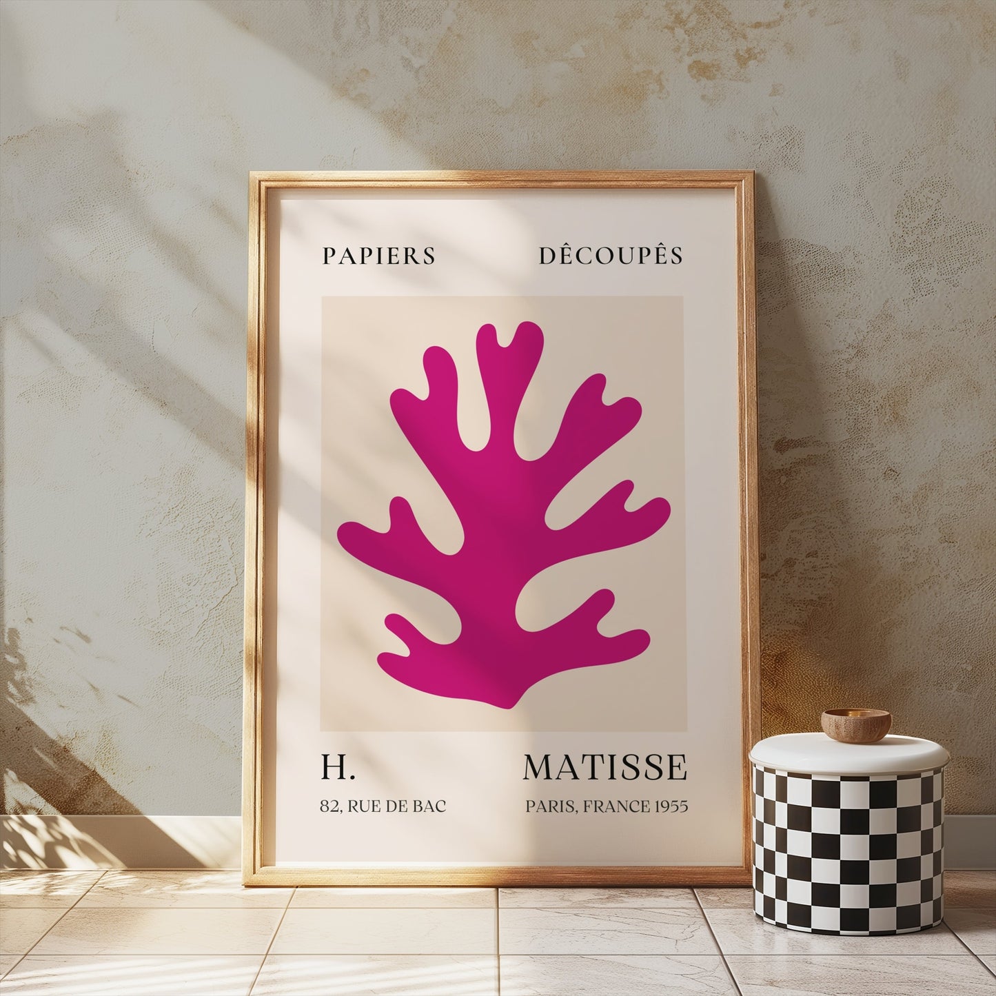 Vintage Papiers Découpés poster by H Matisse, France 1955, framed and leaning against a textured wall with modern decor accents.
