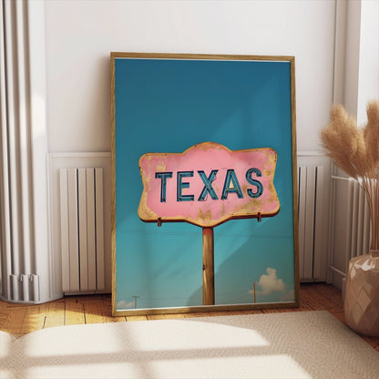 Texas retro sign wall art with a pink and blue color scheme leaning against a wall in a cozy, sunlit interior.