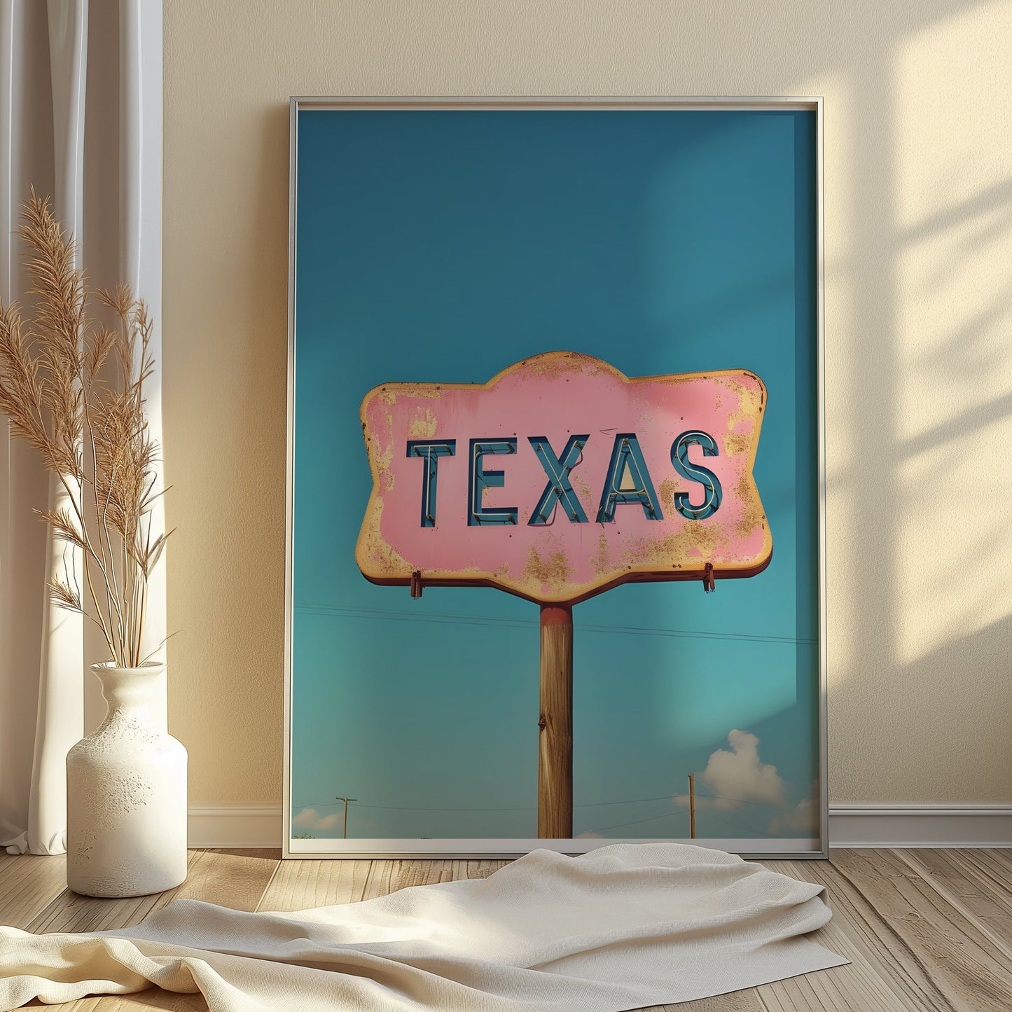 Texas retro sign wall art with a pink and blue vintage design styled in a sunlit room with neutral decor and soft textures.