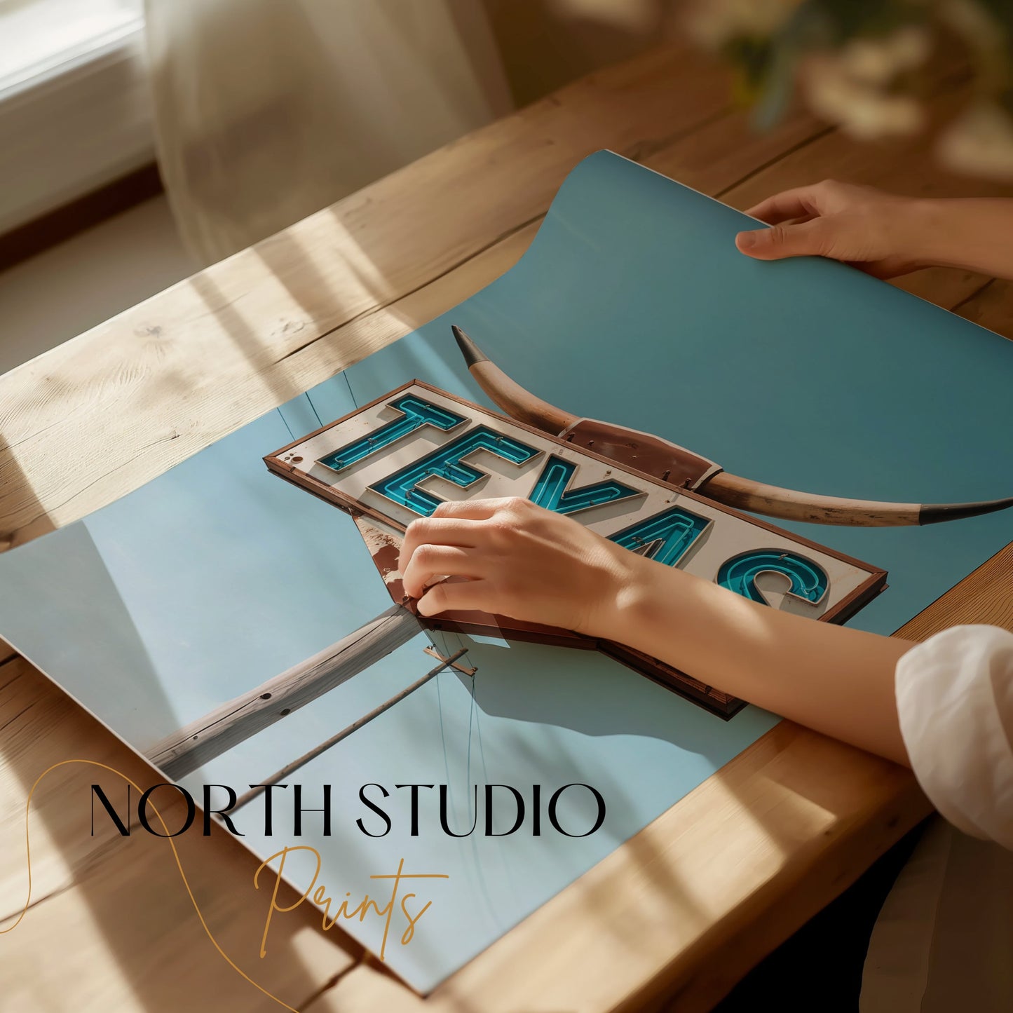 Close-up of a Texas roadside sign art print being unrolled on a wooden table, showcasing its vibrant colors and retro design.