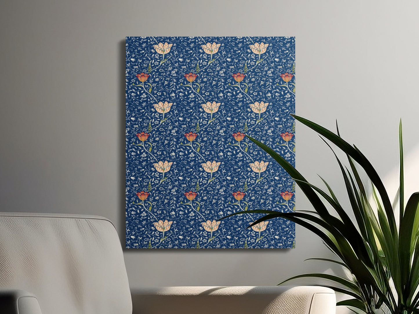William Morris floral canvas wrap with blue and orange botanical design, styled in a modern living room with green plants and neutral furniture.