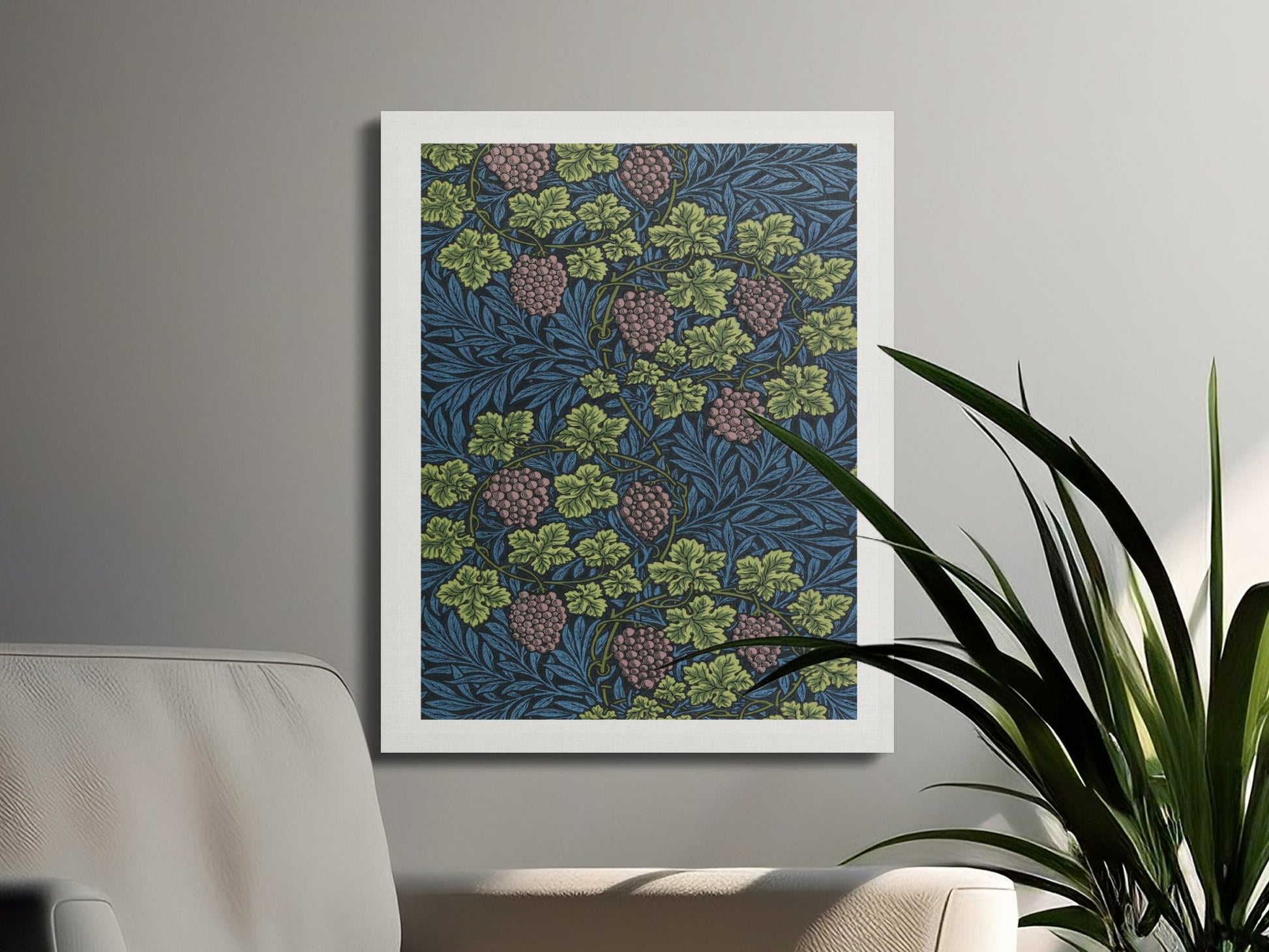William Morris Grape Vines canvas wrap hung in a minimalist living room with a beige sofa and green plant, showcasing vintage botanical artwork.