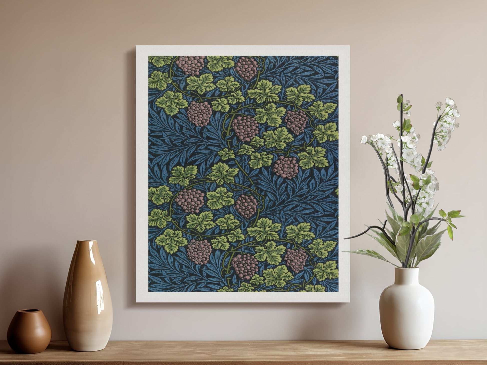 William Morris Grape Vines canvas wrap displayed in a neutral-toned room with vases and flowers, highlighting its retro botanical design.