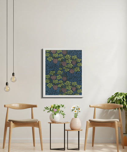 William Morris Grape Vines canvas art in a bright, modern seating area with wooden chairs and potted plants, emphasizing its nature-inspired design.