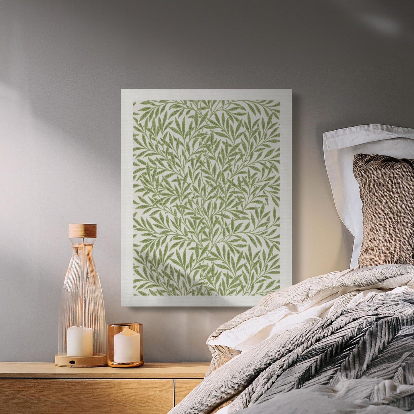 William Morris leafy green pattern canvas wrap displayed in a cozy bedroom setting, complementing neutral-toned bedding and decor.