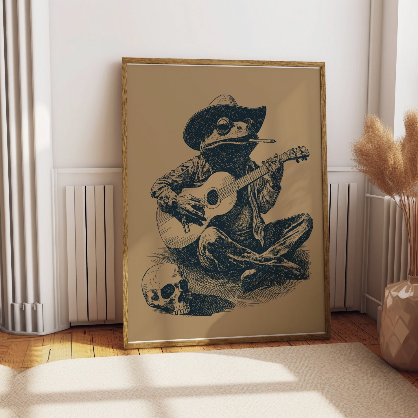 Frog wearing a cowboy hat plays guitar next to a skull.