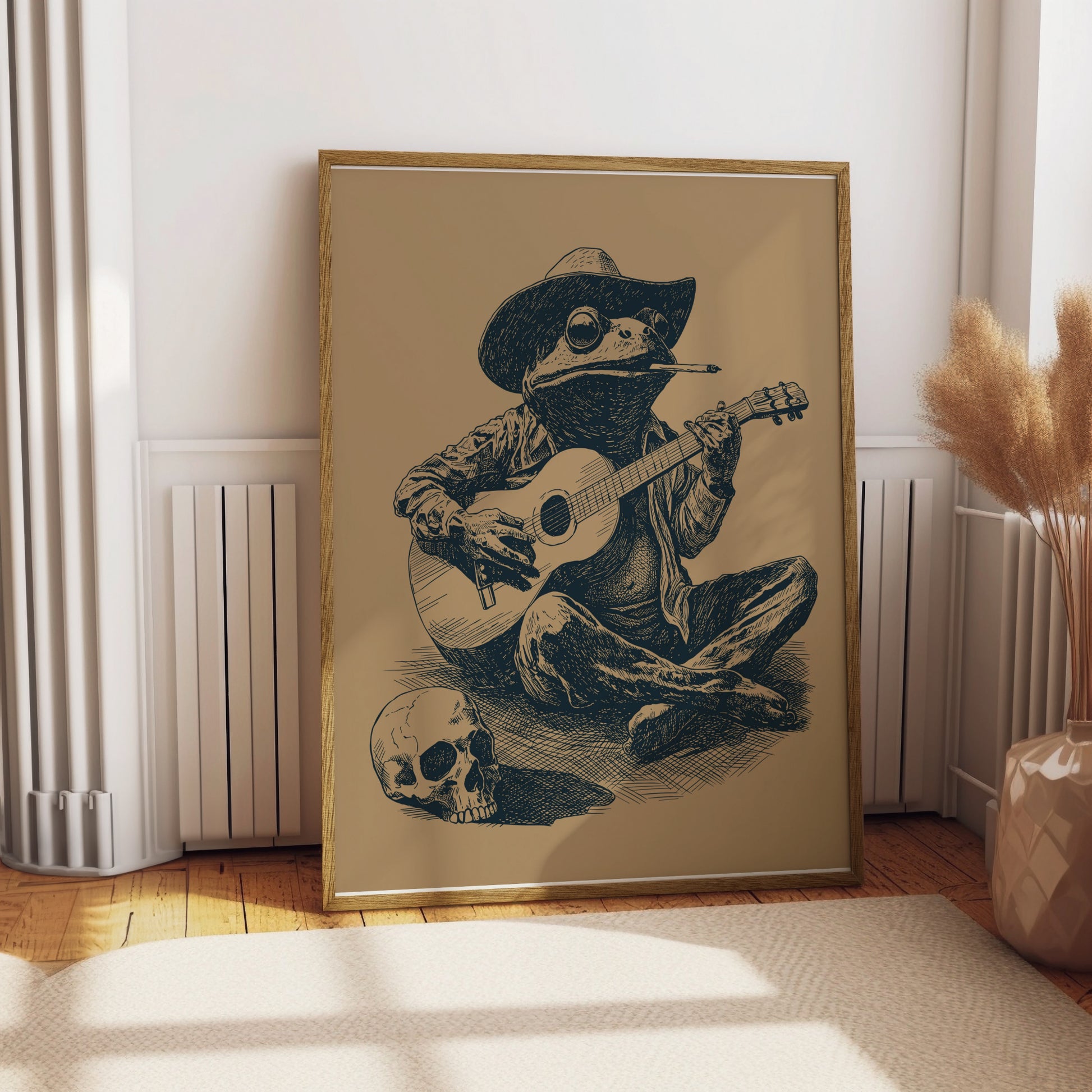 Frog wearing a cowboy hat plays guitar next to a skull.