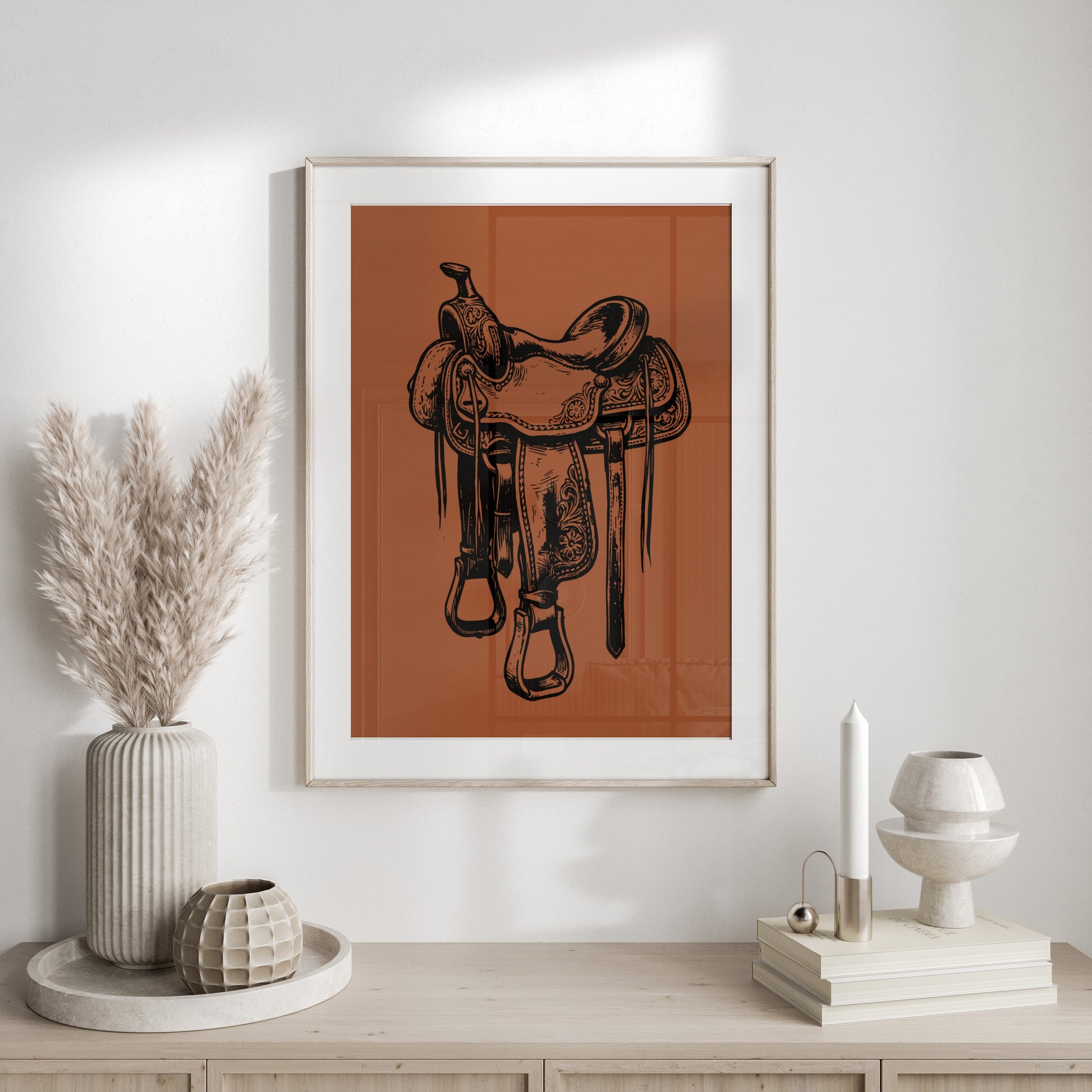 Tattoo-style line drawing of a western saddle on a burnt orange background.