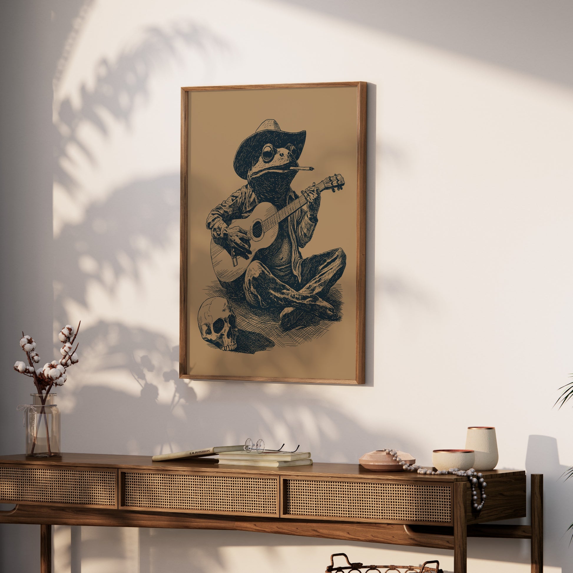 Framed sketch of a cowboy frog playing guitar with a skull.