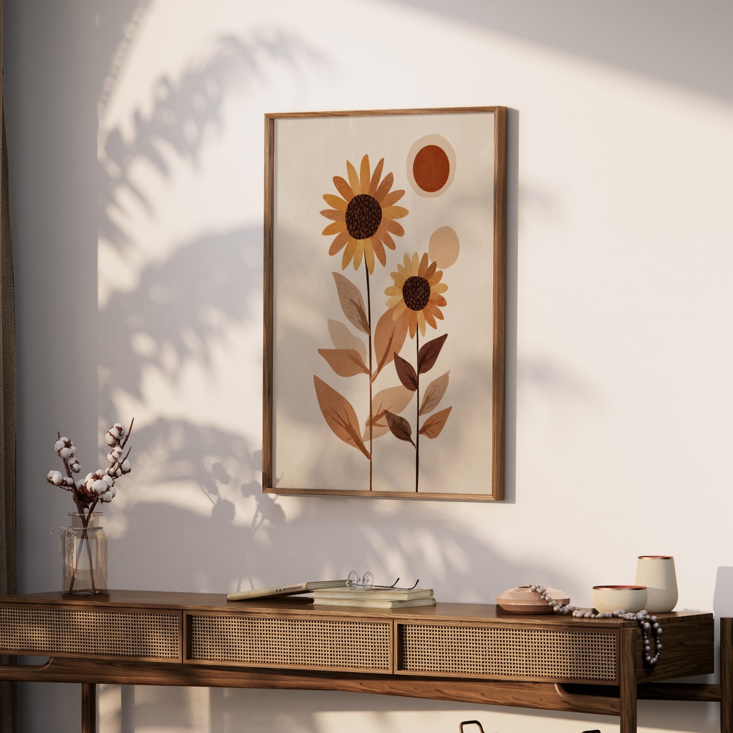Framed botanical art with sunflowers and abstract shapes on a wall.