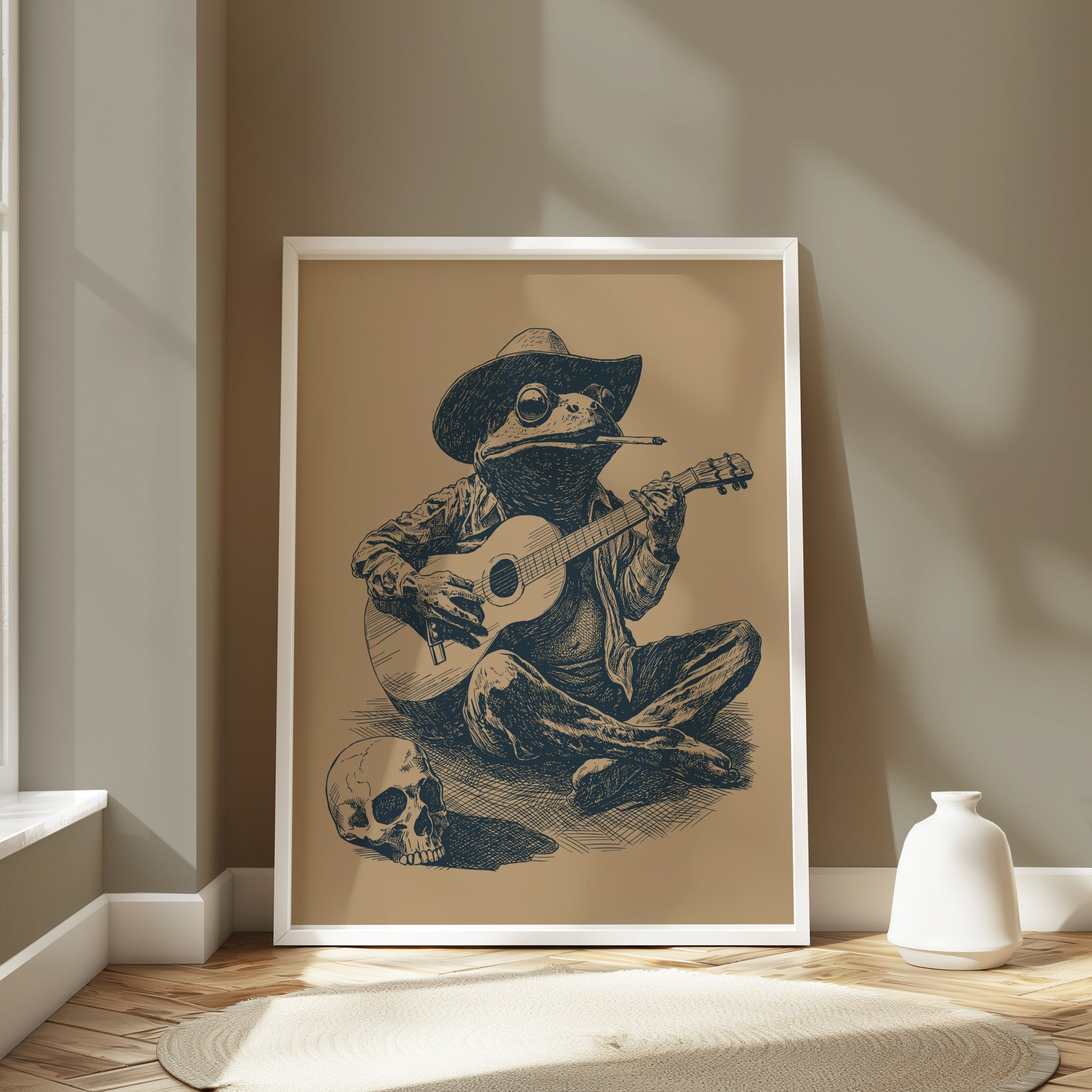 Frog in a cowboy hat plays guitar next to a skull, framed art.